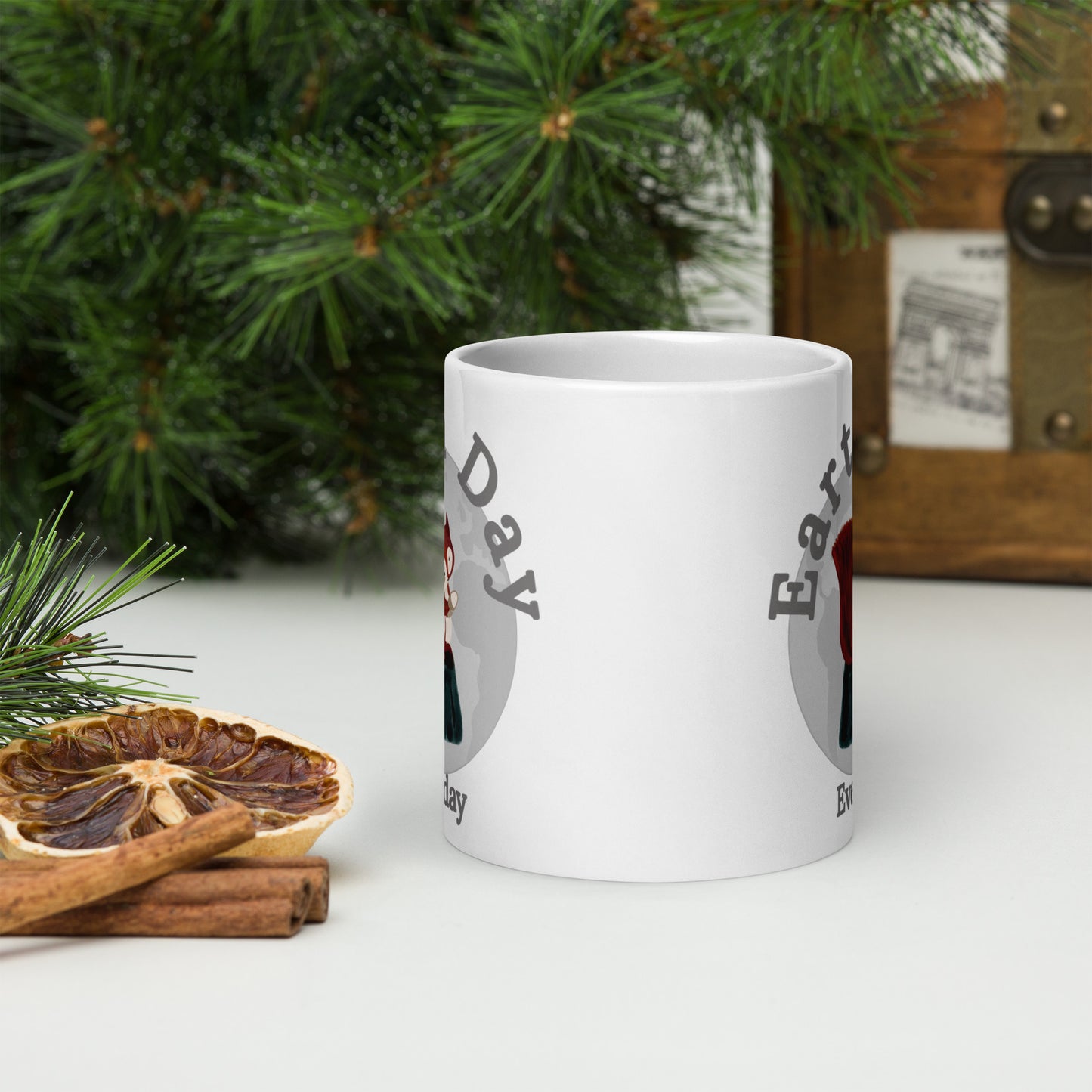 White Earth Day Everyday Squirrels Ceramic Mug with festive pine and dried orange on table