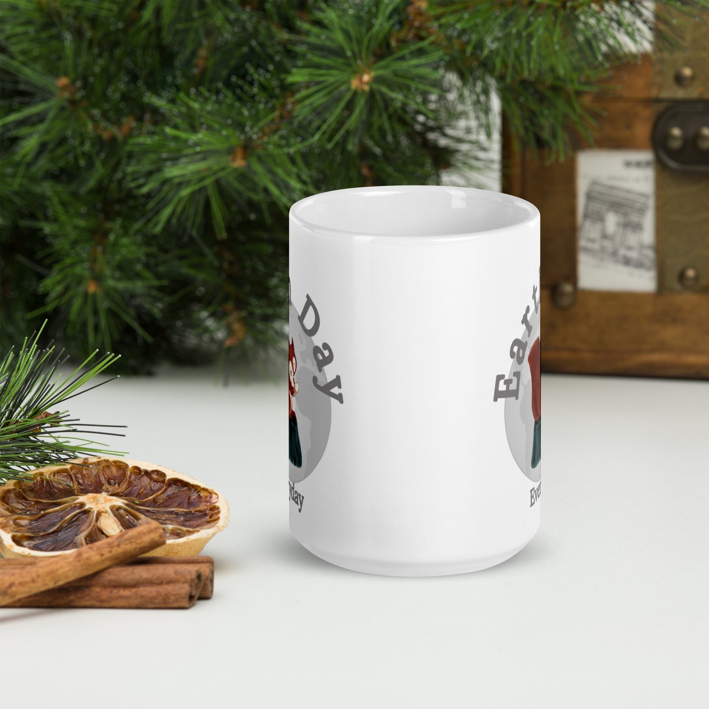White Earth Day Everyday Squirrels Ceramic Mug featuring squirrel design next to pine branches and dried orange slices