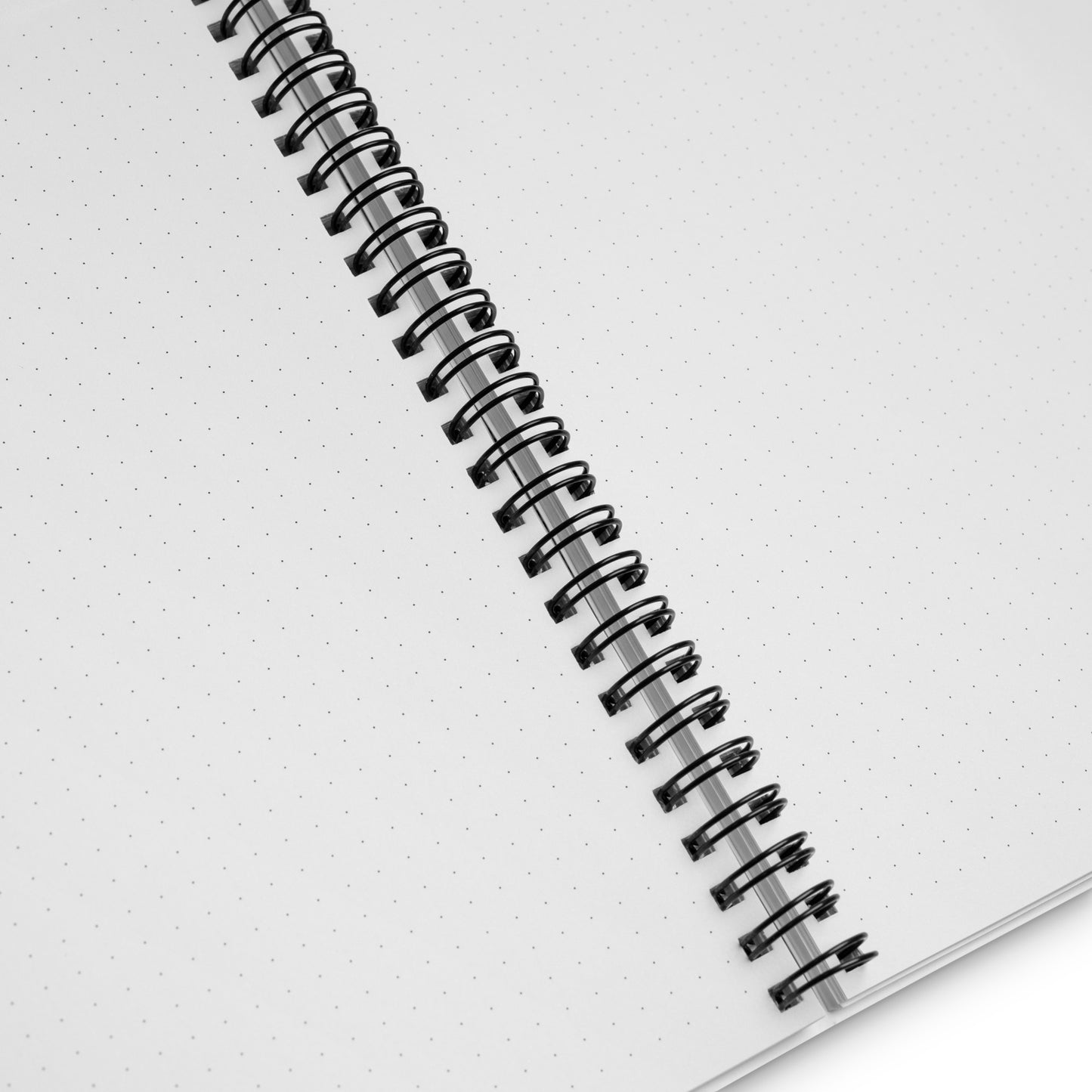 Close-up of Earth Day Everyday Squirrels Spiral Notebook showing dotted grid pages and black spiral binding