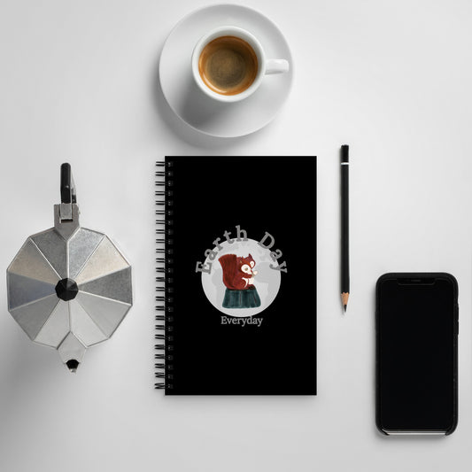 Earth Day Everyday Squirrels Spiral Notebook with black cover featuring a squirrel illustration next to coffee cup and smartphone